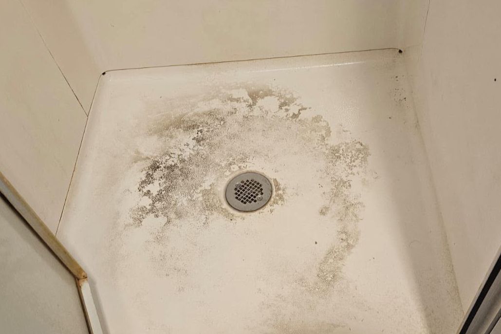 Shower base — before cleaning